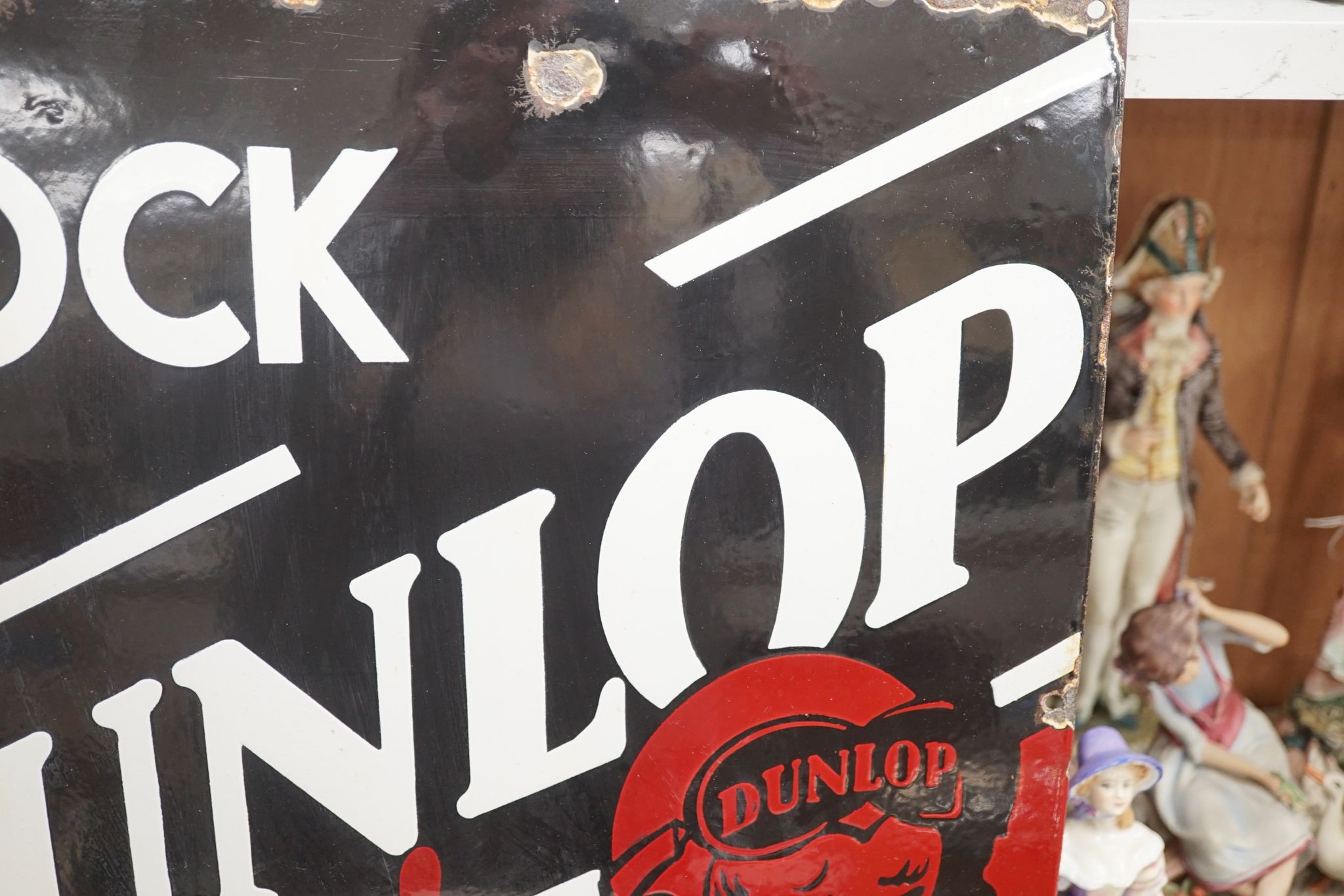 A Dunlop stock enamelled sign 43cm sq